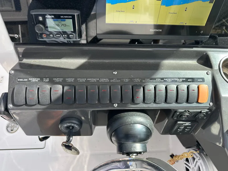 Slide: The Image of Dashboard of 2024 Blackfin 252 DC with switches and Garmin display. - 28