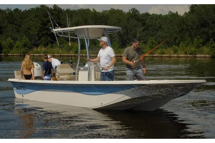 Slide: The Image of Manufacturer Provided Image: 2026 Carolina Skiff 23 LS boat with people fishing on a calm lake. - 10
