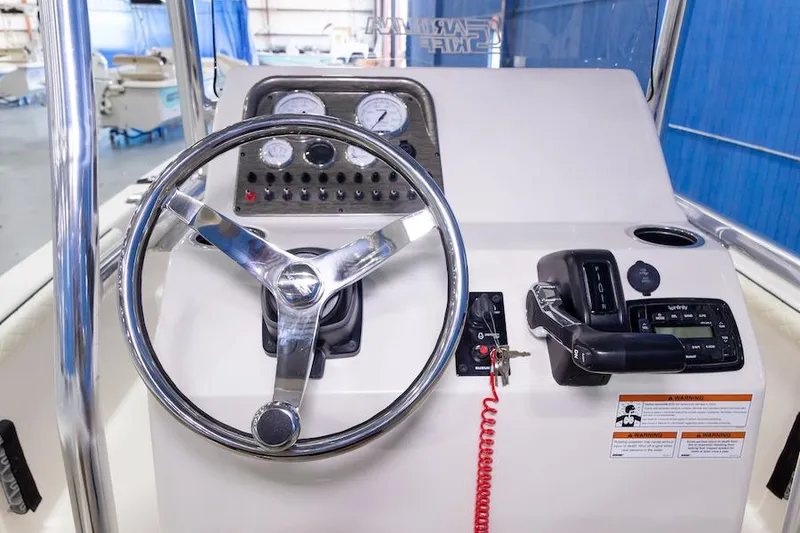 Slide: The Image of Manufacturer Provided Image: 2026 Carolina Skiff 23 LS boat console with steering wheel and control panel. - 14