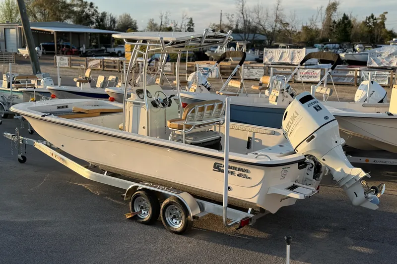 Slide: The Image of 2026 Carolina Skiff 23 LS boat with Suzuki outboard motor on a trailer. - 3