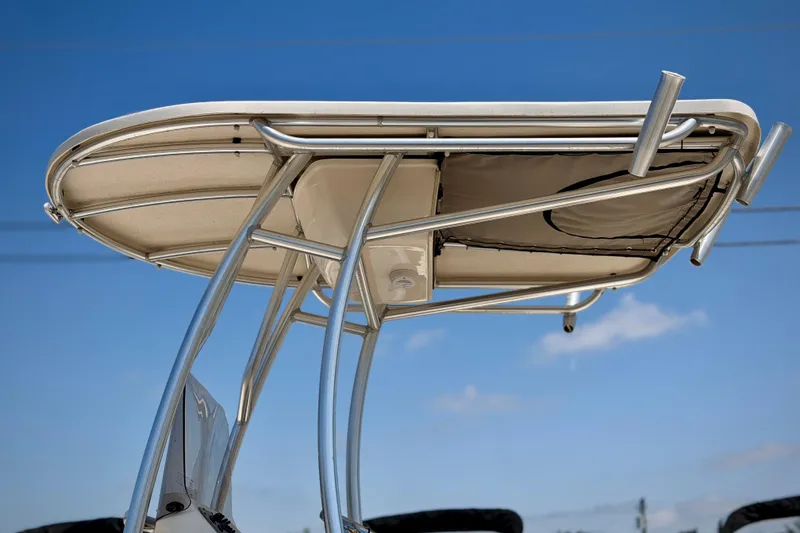 Slide: The Image of T-top of 2026 Carolina Skiff 23 LS boat against clear blue sky. - 6