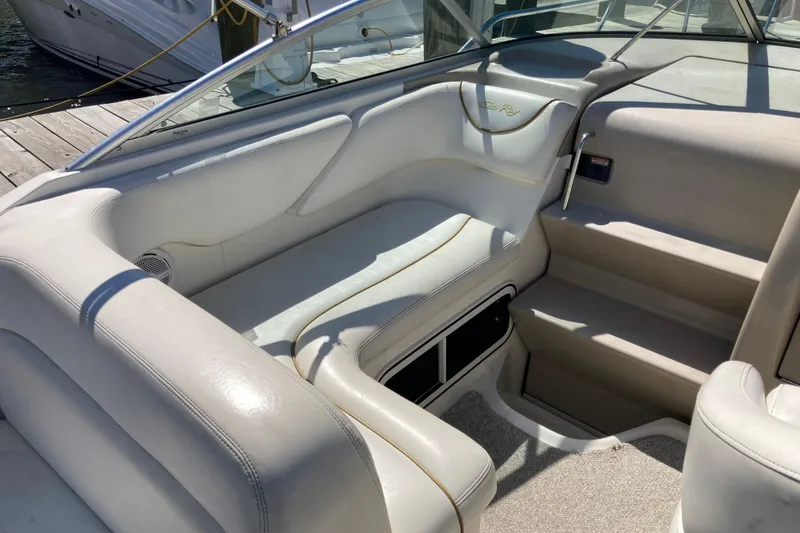 Slide: The Image of Interior view of a 2002 Sea Ray Sundancer 260 boat with white seating. - 21
