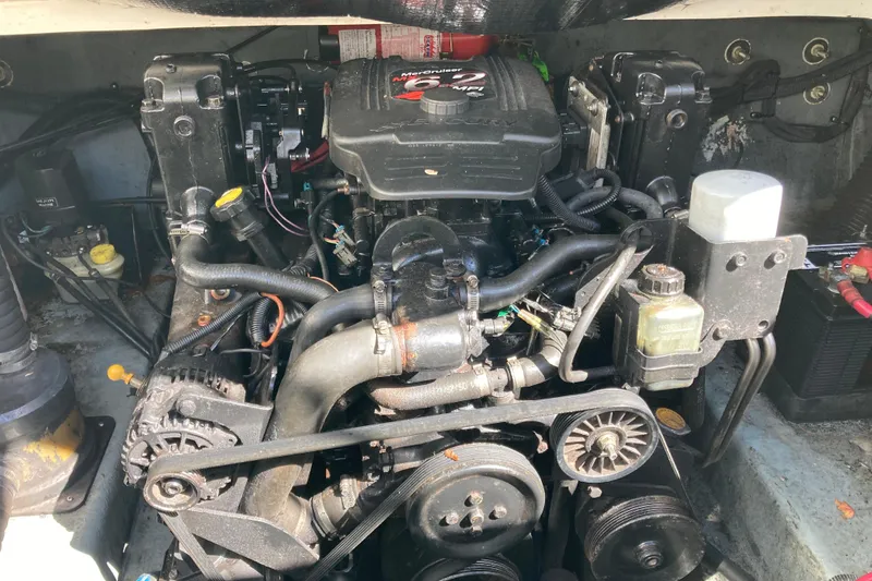 Slide: The Image of Engine compartment of a 2002 Sea Ray Sundancer 260 boat, featuring a MerCruiser engine. - 51