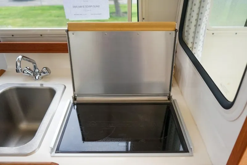 Slide: The Image of Interior of 2018 C-Dory 25' Tomcat Catamaran with sink and stove. - 13