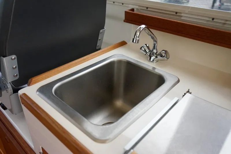 Slide: The Image of Stainless steel sink in 2018 C-Dory 25' Tomcat Catamaran interior. - 14