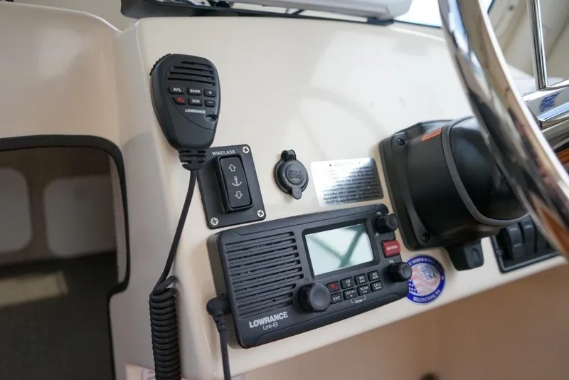 Slide: The Image of Control panel of a 2018 C-Dory 25' Tomcat Catamaran with Lowrance radio equipment. - 18