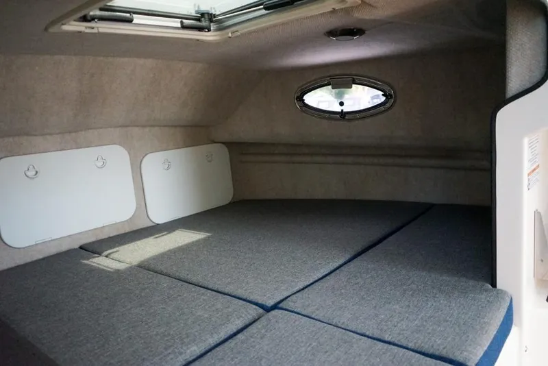Slide: The Image of Interior cabin of 2018 C-Dory 25' Tomcat Catamaran with cushioned sleeping area. - 21