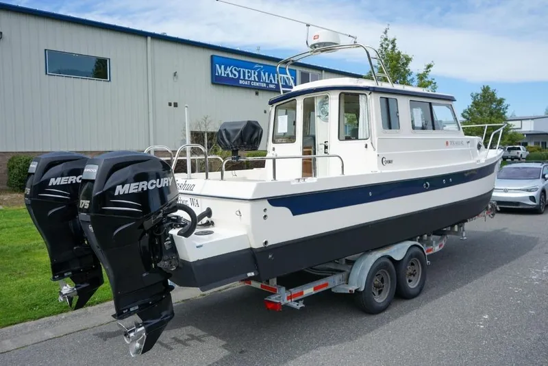 Slide: The Image of 2018 C-Dory 25' Tomcat Catamaran on trailer with dual Mercury engines. - 4