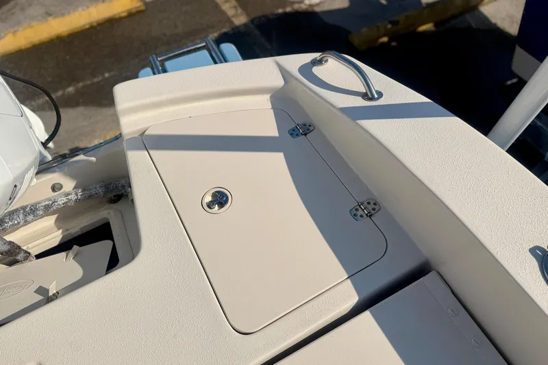 Slide: The Image of 2026 Carolina Skiff 22 Ultra Elite boat deck with storage compartment and handle. - 10