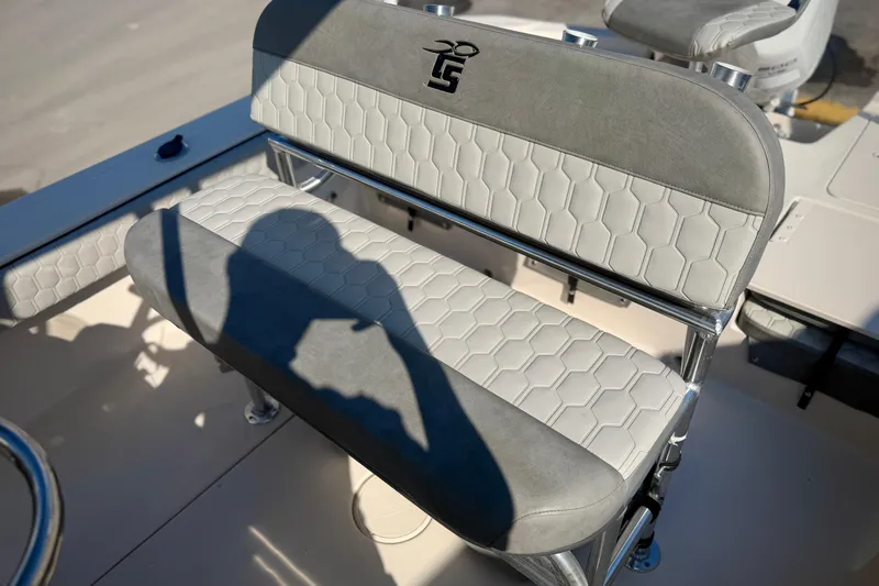 Slide: The Image of 2026 Carolina Skiff 22 Ultra Elite boat seat with hexagonal pattern and logo. - 12