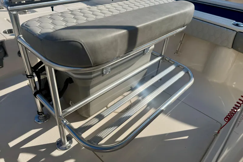 Slide: The Image of 2026 Carolina Skiff 22 Ultra Elite boat seat with storage and metal frame. - 15