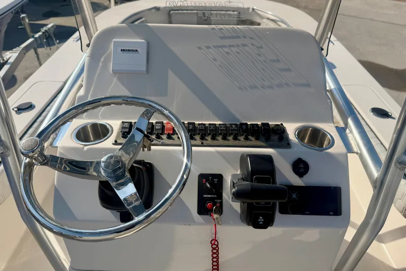 Slide: The Image of Steering console of 2026 Carolina Skiff 22 Ultra Elite with Honda controls. - 18