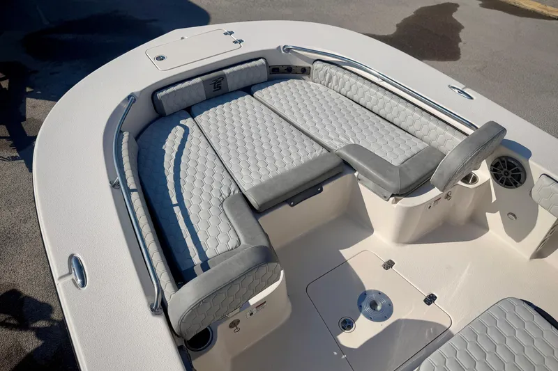 Slide: The Image of 2026 Carolina Skiff 22 Ultra Elite boat interior with cushioned seating and sleek design. - 24