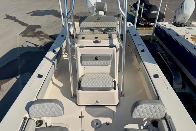 Slide: The Image of 2026 Carolina Skiff 22 Ultra Elite boat interior with seating and console. - 25