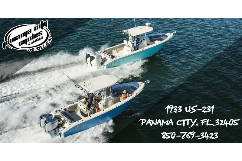 Slide: The Image of Two Carolina Skiff 22 Ultra Elite boats cruising on water, Panama City Cycles logo visible. - 30