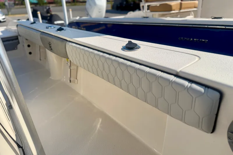 Slide: The Image of 2026 Carolina Skiff 22 Ultra Elite boat interior with padded side panel detail. - 33