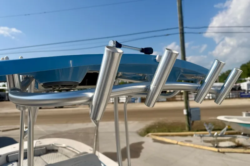 Slide: The Image of 2026 Carolina Skiff 22 Ultra Elite boat with rod holders and blue T-top. - 35