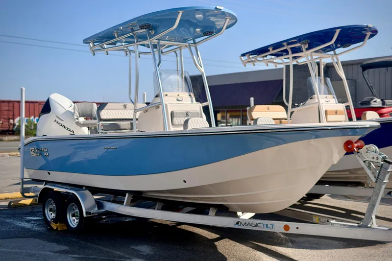 Slide: The Image of 2026 Carolina Skiff 22 Ultra Elite boat on trailer, featuring Honda engine. - 41