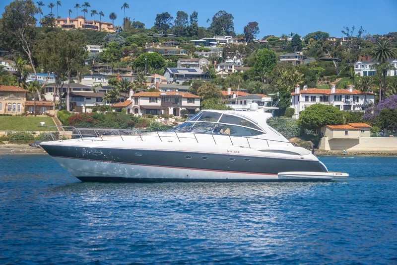 The Image of 2005 Cruisers Yachts 540 Express on scenic waterfront with luxury homes in background. - 0
