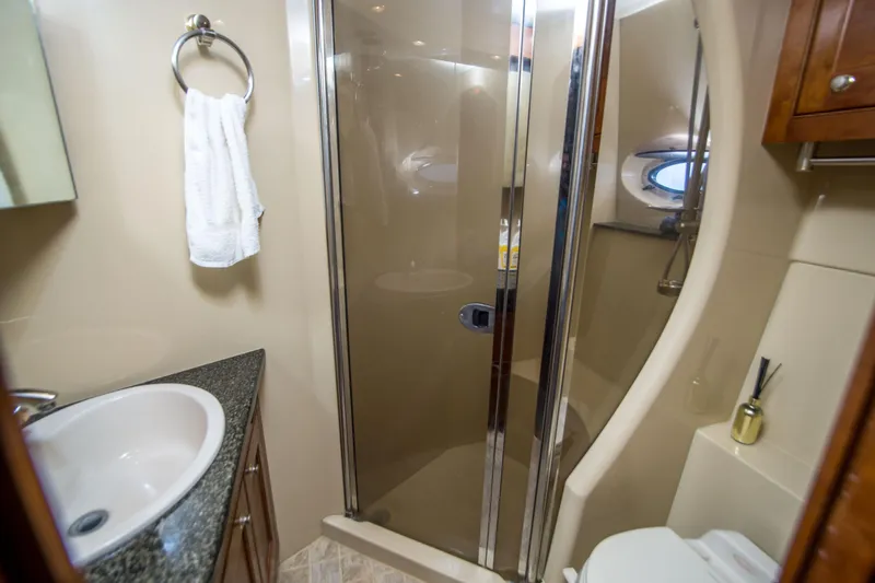 Slide: The Image of Luxurious bathroom in 2005 Cruisers Yachts 540 Express with shower and sink. - 31