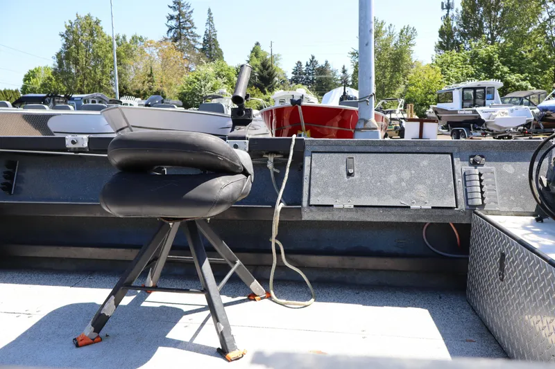 Slide: The Image of 2017 Alumaweld Super Vee LT 20 boat interior with swivel seat and storage compartments. - 7