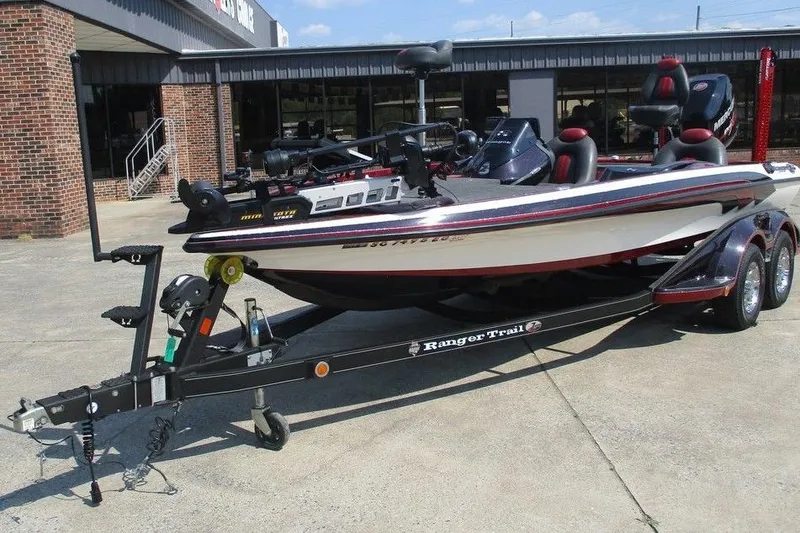 Slide: The Image of 2012 Ranger Z520 boat on trailer, parked outside a brick building. - 3