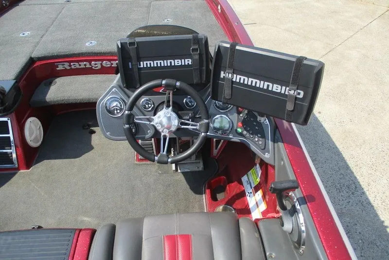 Slide: The Image of 2012 Ranger Z520 boat cockpit with steering wheel and Humminbird electronics. - 5