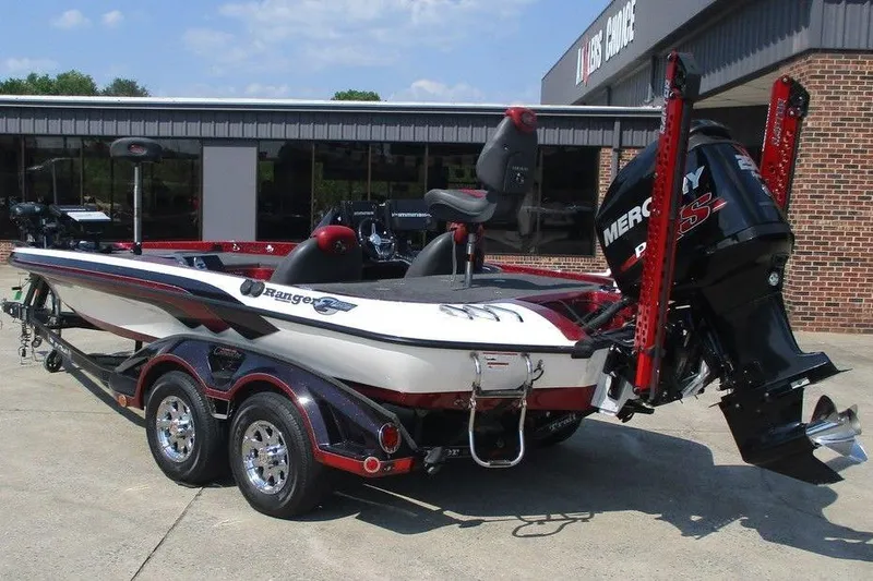 Slide: The Image of 2012 Ranger Z520 boat with Mercury engine, parked outside a dealership. - 7