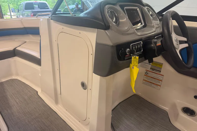 Slide: The Image of 2017 Chaparral Vortex 203 VRX boat interior with steering console and seating. - 10