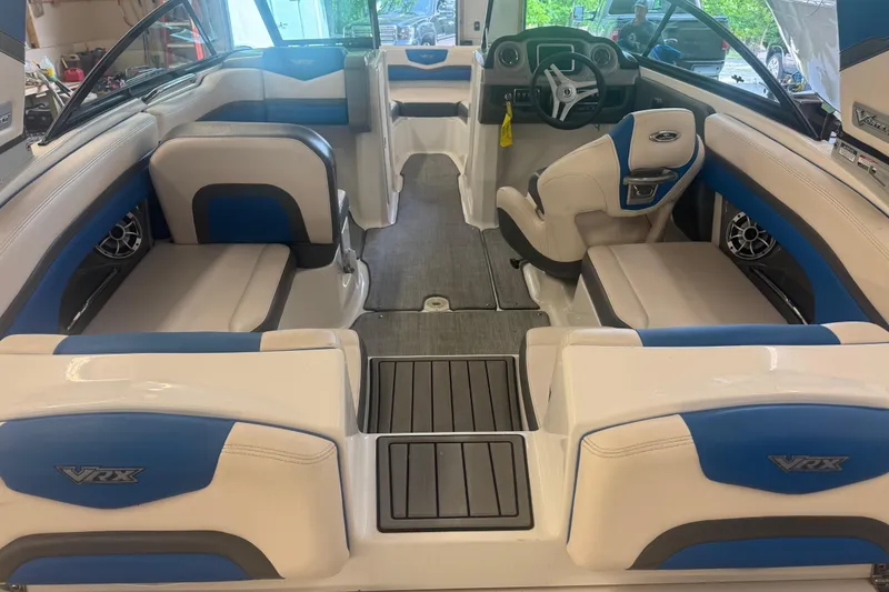 Slide: The Image of Interior of a 2017 Chaparral Vortex 203 VRX boat with blue and white seating. - 7