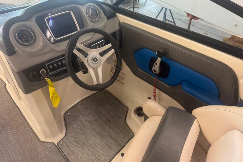 Slide: The Image of 2017 Chaparral Vortex 203 VRX boat interior with steering wheel and dashboard controls. - 8