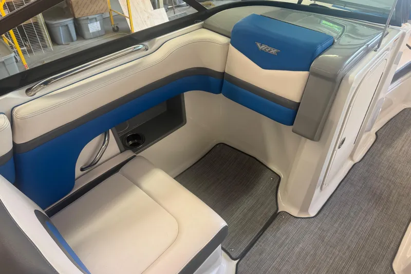 Slide: The Image of 2017 Chaparral Vortex 203 VRX boat interior with blue and gray seating. - 9