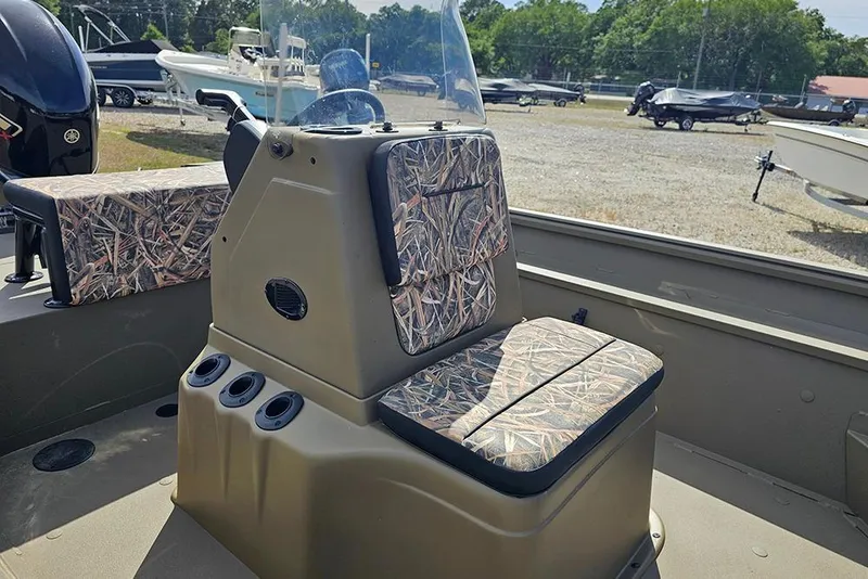 Slide: The Image of 2026 G3 Gator Tough 18 CC boat interior with camouflage seating and console. - 11