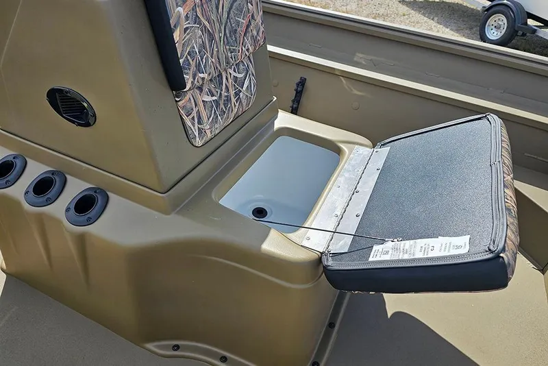 Slide: The Image of 2026 G3 Gator Tough 18 CC boat interior with open storage compartment. - 12
