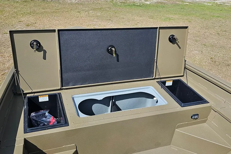 Slide: The Image of 2026 G3 Gator Tough 18 CC boat storage compartments and livewell on deck. - 14