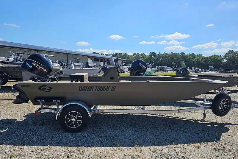 Slide: The Image of 2026 G3 Gator Tough 18 CC boat on trailer, sunny day, outdoor display. - 19