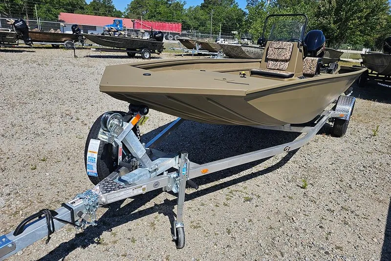 Slide: The Image of 2026 G3 Gator Tough 18 CC boat on trailer in outdoor setting. - 24