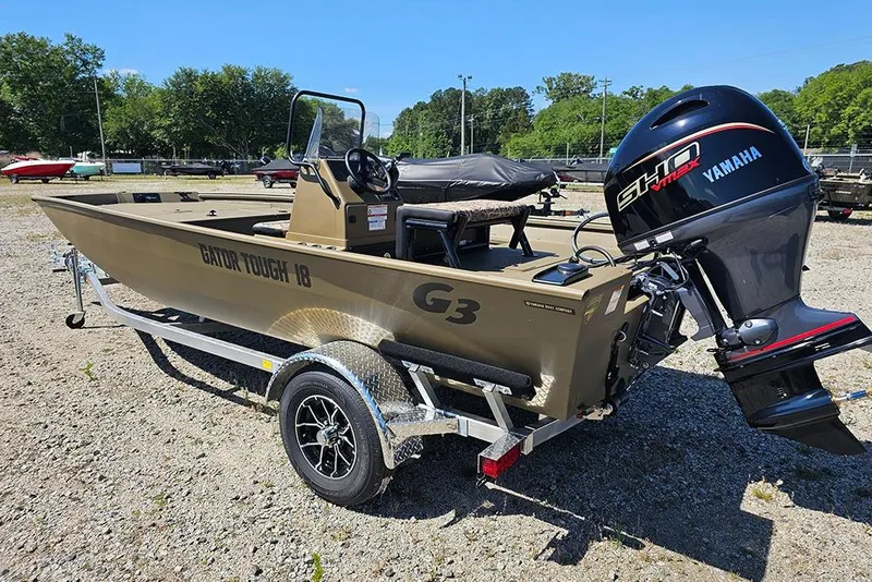 Slide: The Image of 2026 G3 Gator Tough 18 CC boat with Yamaha engine on trailer in outdoor setting. - 26