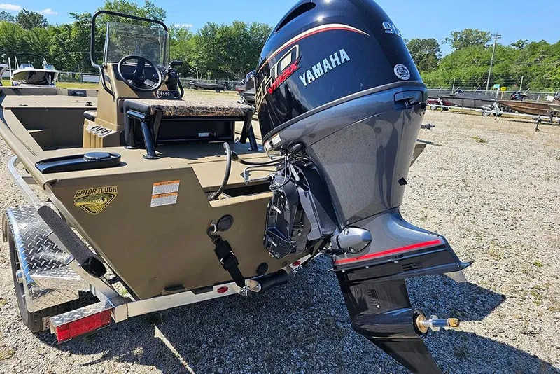 Slide: The Image of 2026 G3 Gator Tough 18 CC boat with Yamaha outboard motor on trailer. - 28