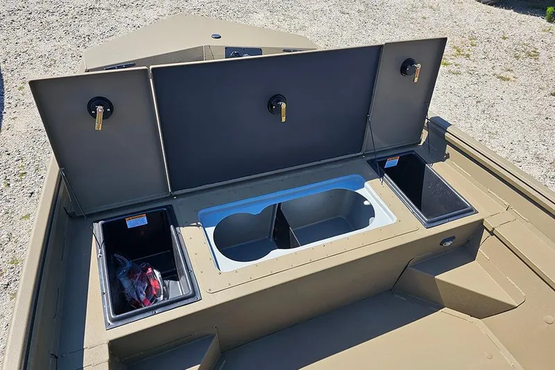 Slide: The Image of 2026 G3 Gator Tough 18 CC boat storage compartments open on deck. - 34