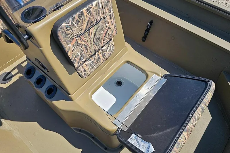 Slide: The Image of 2026 G3 Gator Tough 18 CC boat interior with camo seat and storage compartment. - 36