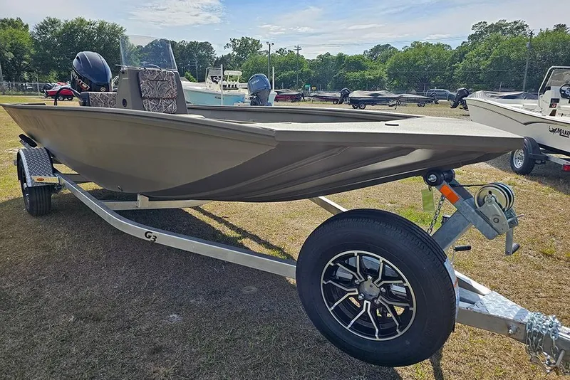 Slide: The Image of 2026 G3 Gator Tough 18 CC boat on trailer, parked outdoors. - 6