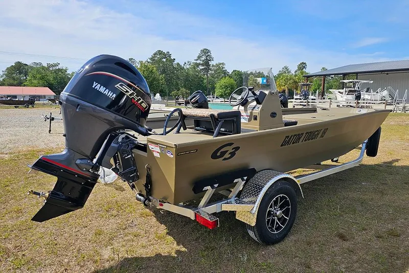 Slide: The Image of 2026 G3 Gator Tough 18 CC boat with Yamaha engine on trailer, outdoors. - 8