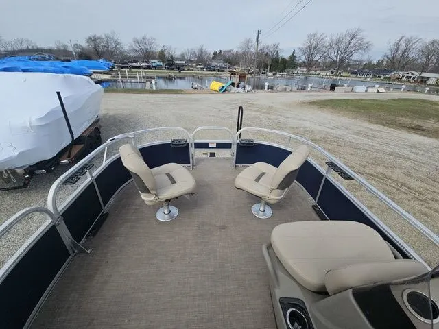 Slide: The Image of 2020 Sun Tracker Bass Buggy 16 XL pontoon boat at dock. - 4