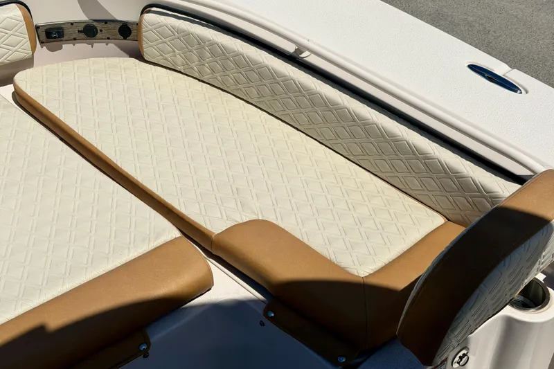 Slide: The Image of 2026 Carolina Skiff 24 Ultra Elite boat seating with diamond-pattern upholstery. - 18