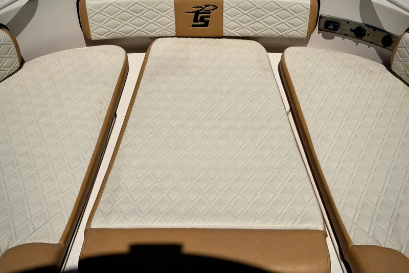 Slide: The Image of 2026 Carolina Skiff 24 Ultra Elite boat interior with diamond-patterned upholstery. - 19