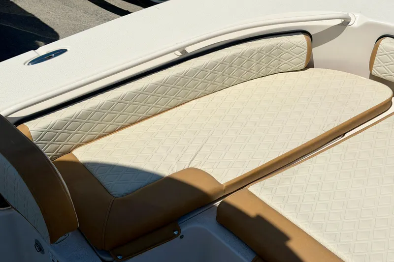 Slide: The Image of 2026 Carolina Skiff 24 Ultra Elite boat seating with diamond-pattern upholstery. - 20