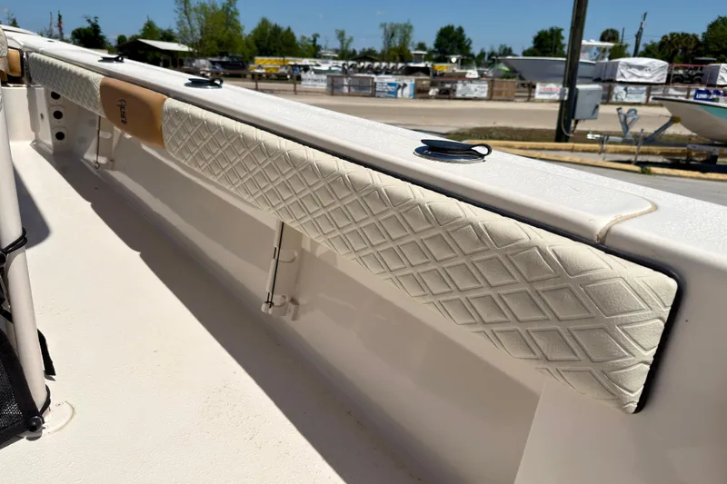 Slide: The Image of 2026 Carolina Skiff 24 Ultra Elite boat interior with diamond-patterned upholstery. - 24