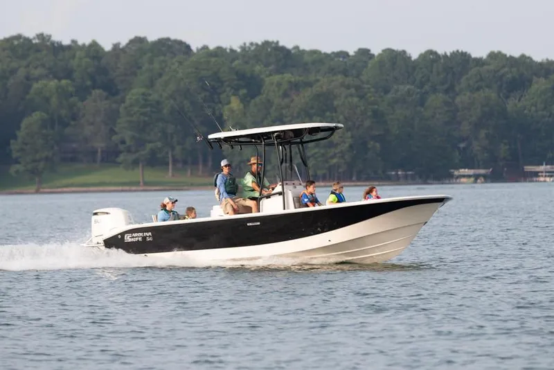 Slide: The Image of Manufacturer Provided Image: 2026 Carolina Skiff 24 Ultra Elite boat cruising on a lake with passengers. - 33