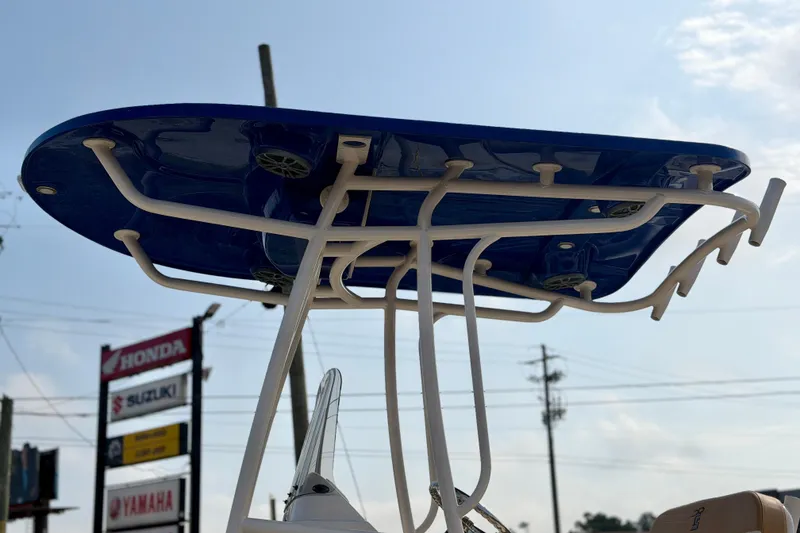 Slide: The Image of T-top of 2026 Carolina Skiff 24 Ultra Elite boat against a clear sky. - 39